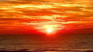 On the beach, sun loungers, beach towels