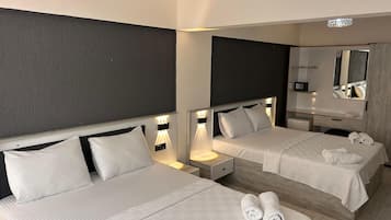 Standard Quadruple Room | In-room safe, individually decorated, individually furnished, desk