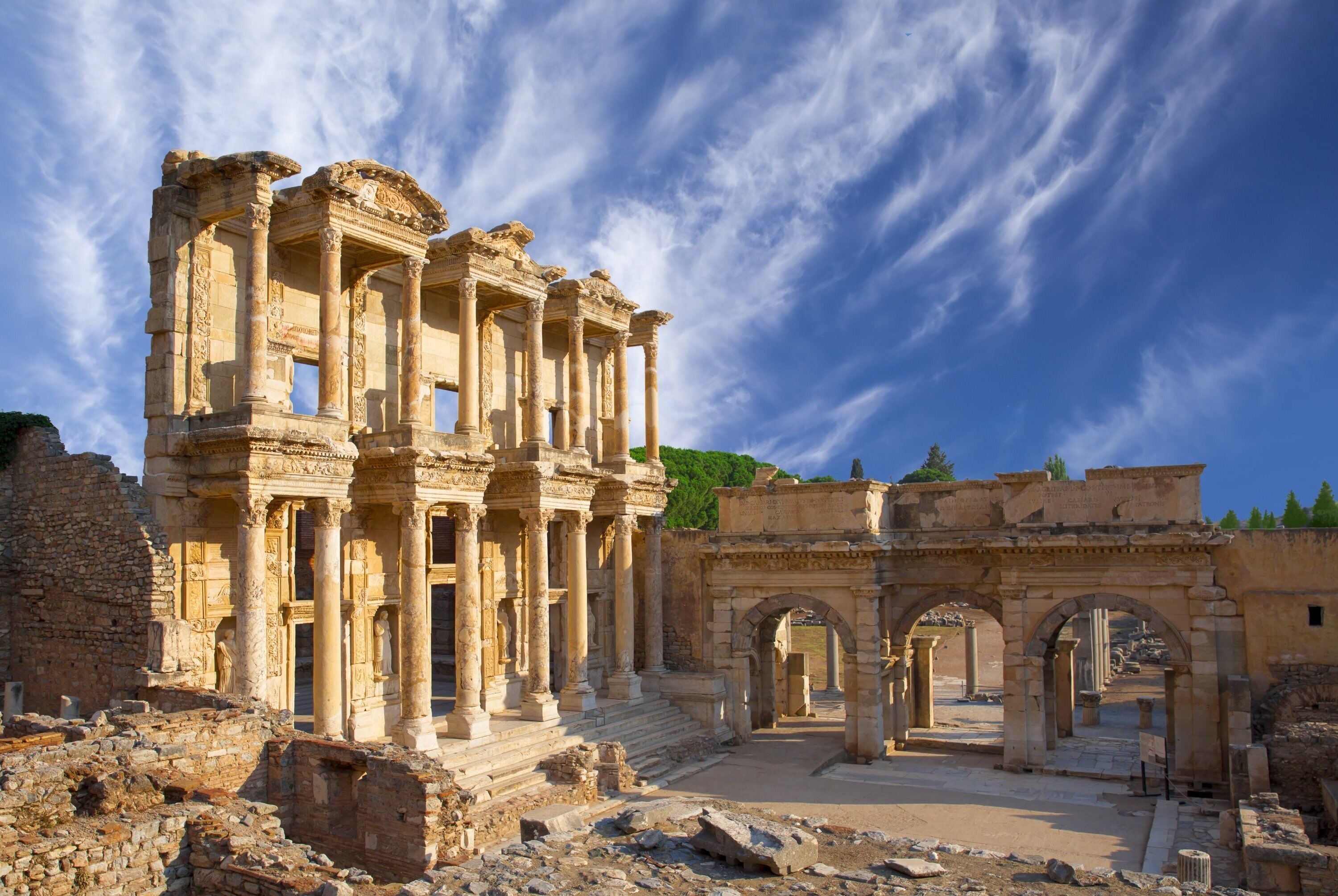 Ancient ruins with columns and arches, likely a historical site.