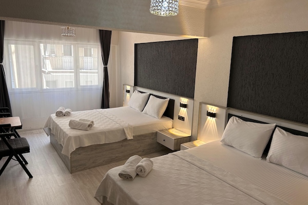 Standard Quadruple Room | In-room safe, individually decorated, individually furnished, desk