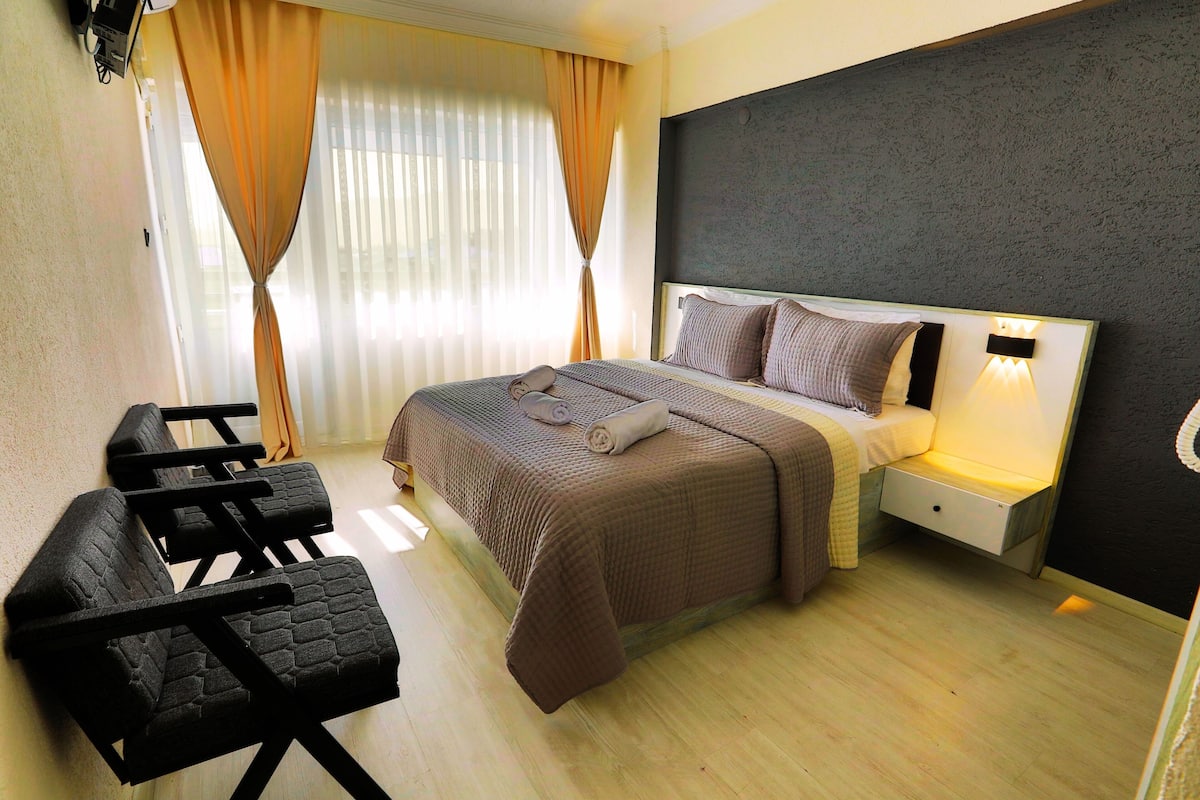 Standard Double Room, Balcony, City View | In-room safe, individually decorated, individually furnished, desk