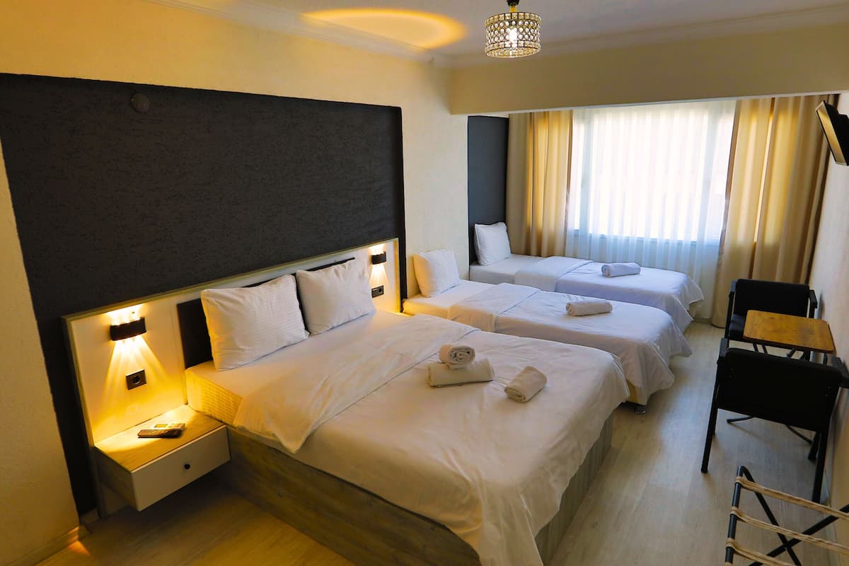 Family Quadruple Room, 1 Bedroom, Non Smoking | In-room safe, individually decorated, individually furnished, desk