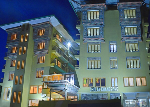A multi-story building with balconies and a sign reading "CHOLAY KHANGZANG". - Cholay khangzang (Thimphu)