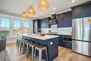 Fridge, microwave, oven, stovetop - Fritz's Fantasea: Ocean View Island Home with Pool, Elevator (Oak Island)