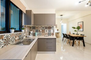 Fridge, oven, coffee/tea maker, cookware/dishes/utensils