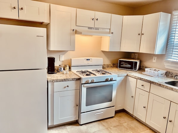 Microwave, oven, stovetop, dining tables