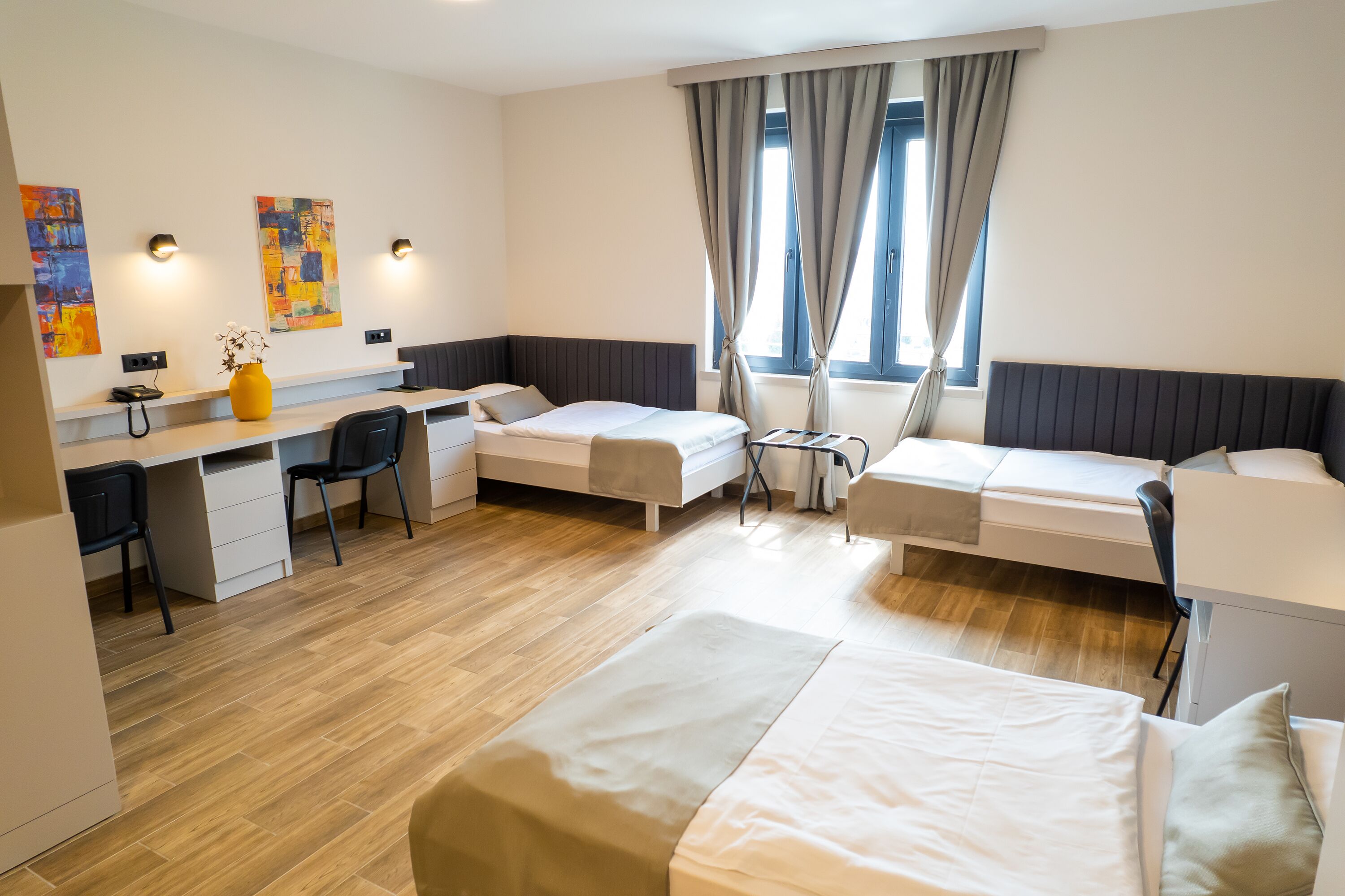 basic triple room | minibar, in-room safe, desk, blackout curtains