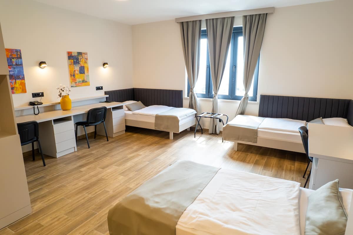 basic triple room | minibar, in-room safe, desk, blackout curtains