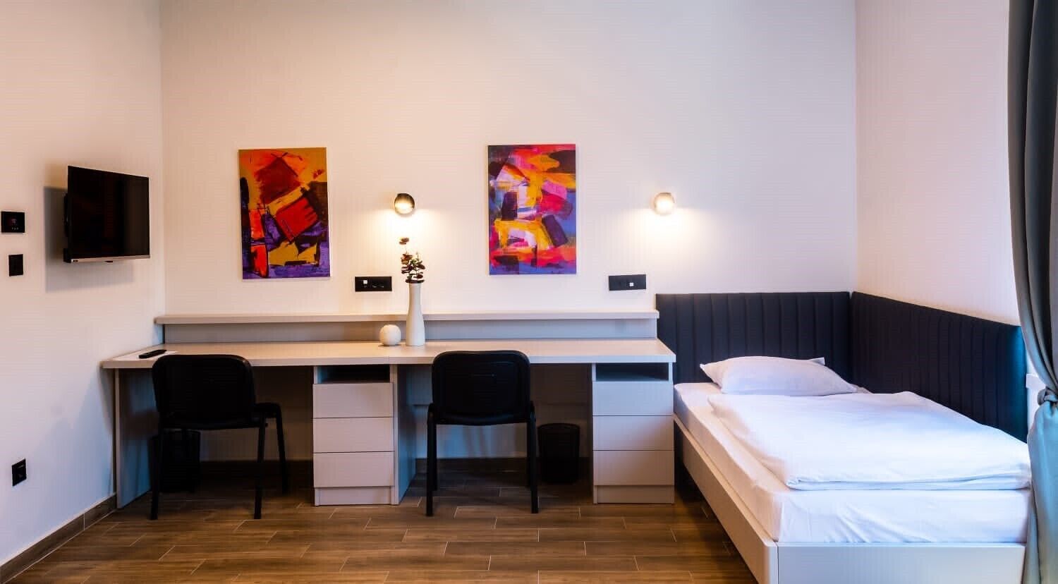 basic triple room | minibar, in-room safe, desk, blackout curtains