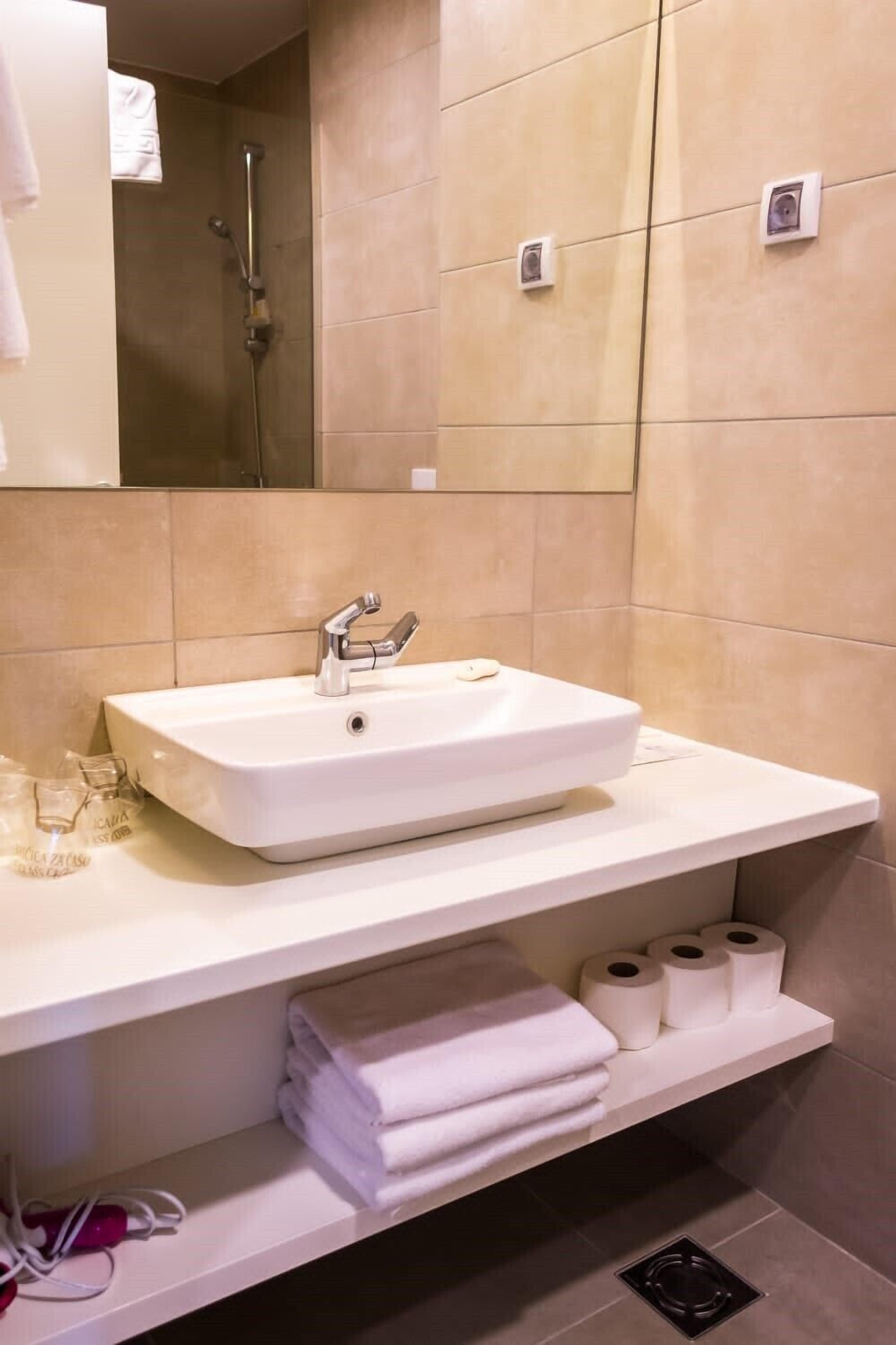 basic double or twin room | bathroom | shower, rainfall showerhead, hair dryer, towels