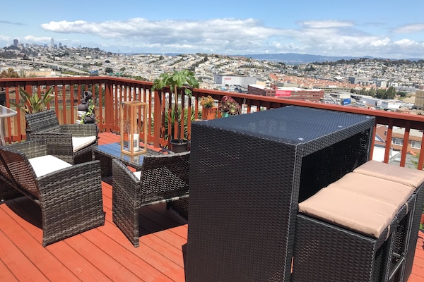 Birds-eye view of Salesforce Tower, Bay Bridge, and the city right on our deck.