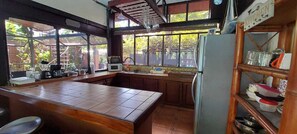 Microwave, coffee/tea maker, cookware/dishes/utensils, dining tables