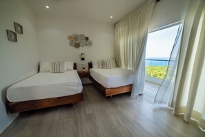 Down duvets, pillow-top beds, in-room safe, individually decorated - High Life Resort and Spa (Negril)