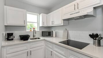 Fridge, microwave, stovetop, coffee/tea maker