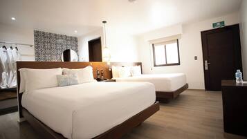 Family Room | 1 bedroom, premium bedding, minibar, in-room safe