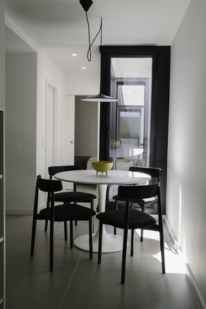 Enjoy meals in this stylish dining area with a round table and four chairs.