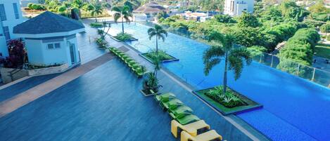 Outdoor pool, open 6:00 AM to 10:00 PM, lifeguards on site