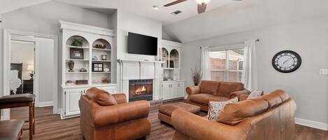 Smart TV, fireplace, books