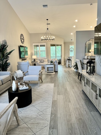 Open concept living space with high ceilings.