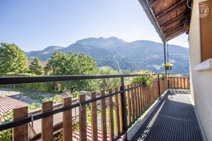 Enjoy breathtaking views of the surrounding mountains from this balcony.