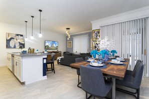 Exclusive House | Living area | 60-inch Smart TV with cable channels, Netflix, Hulu - Stunning 4 Bd w/ Pool Close to Disney at Champions Gate 1158 (Davenport)