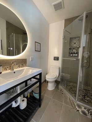 Shower, hair dryer, towels, soap