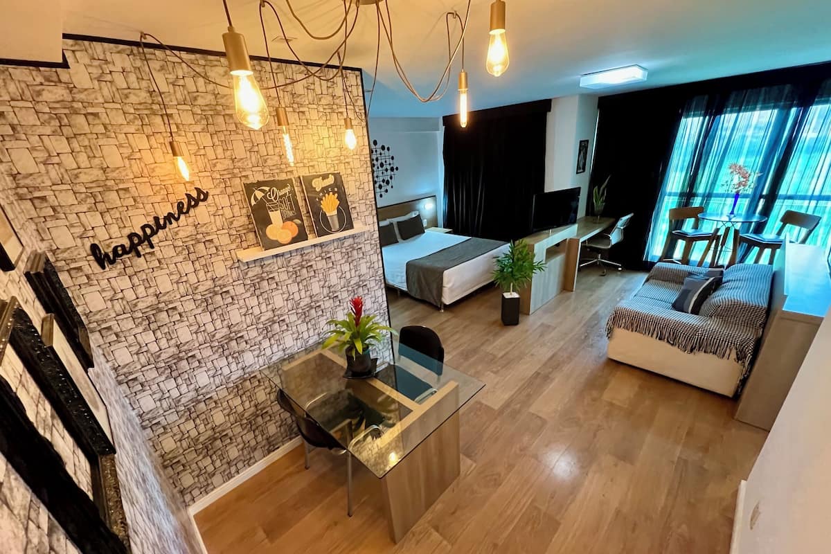 Comfort Loft | 1 bedroom, in-room safe, desk, bed sheets