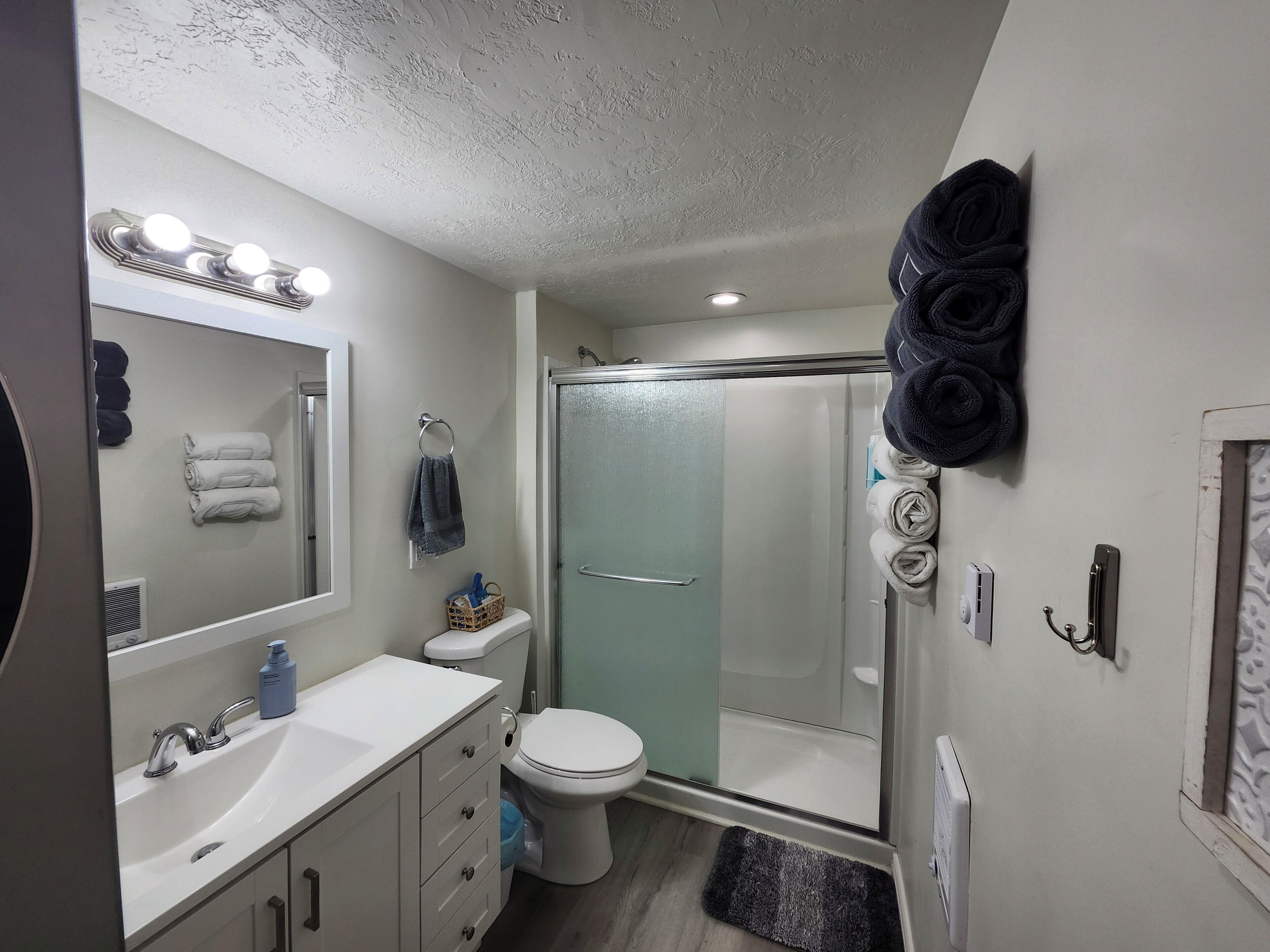 Shower, hair dryer, towels, soap