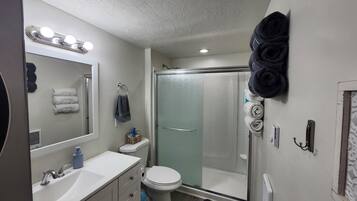 Shower, hair dryer, towels, soap