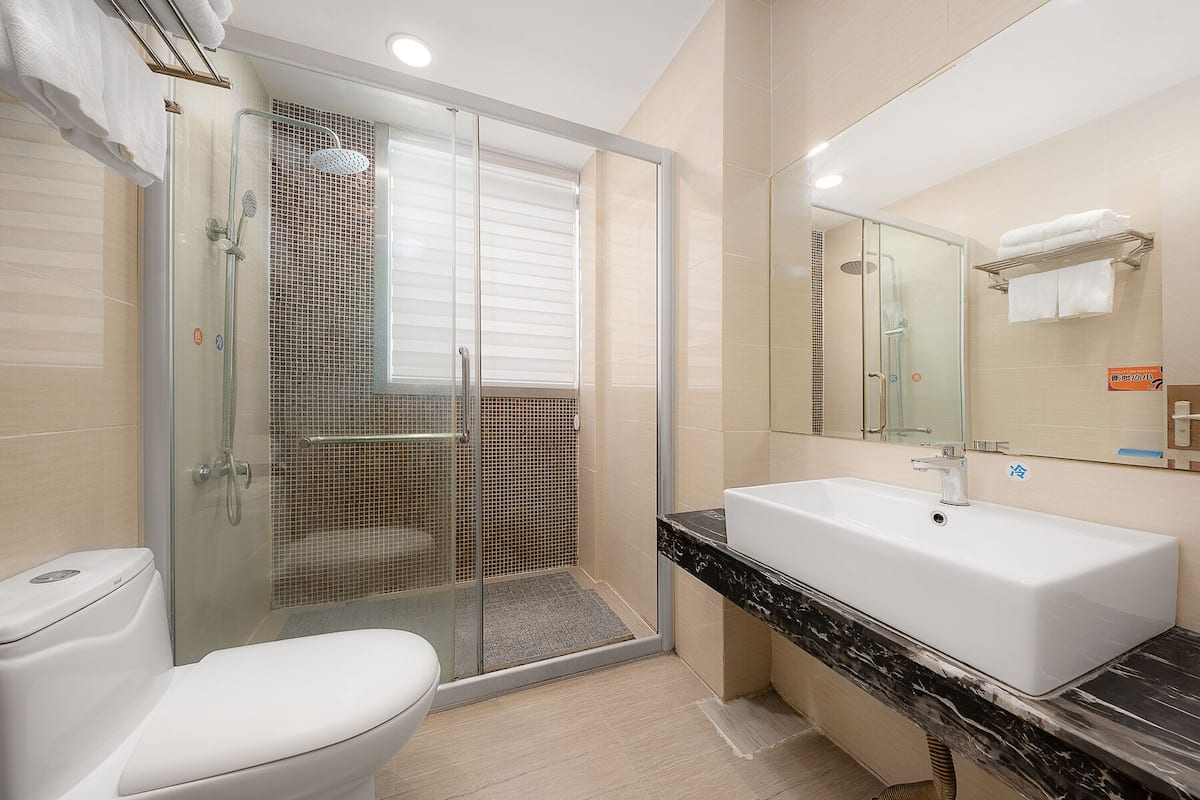 shower, rainfall showerhead, designer toiletries, hair dryer