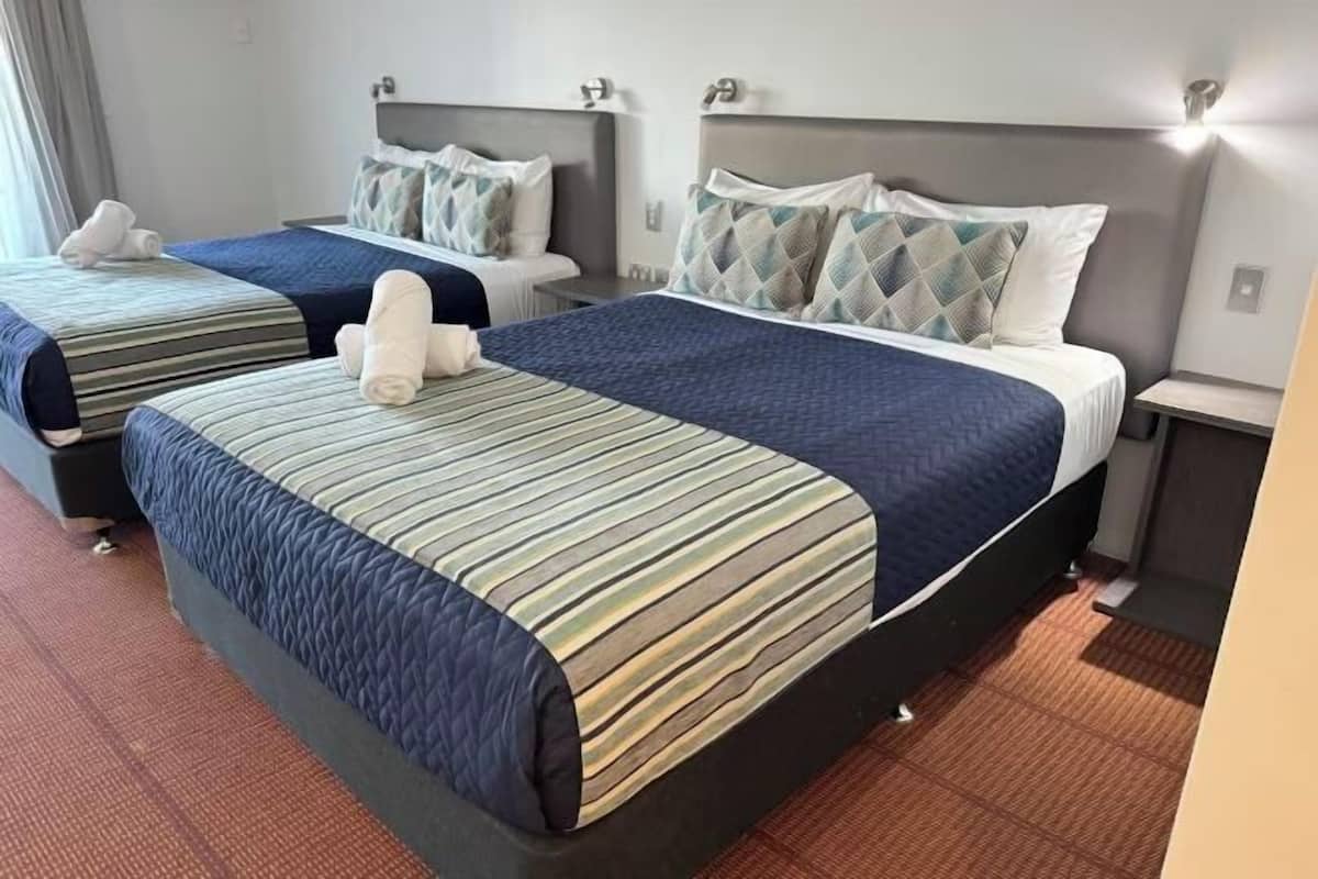 Desk, blackout curtains, iron/ironing board, bed sheets