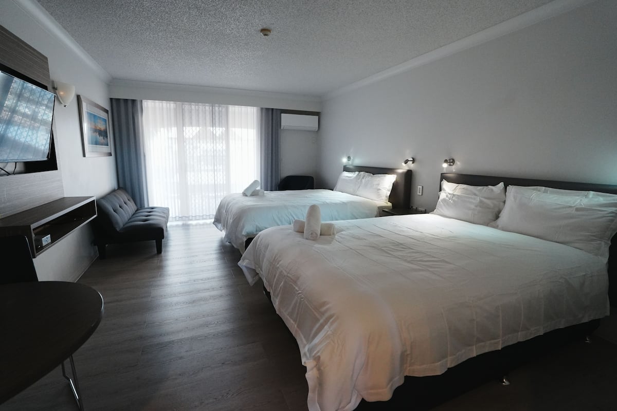 Desk, blackout drapes, iron/ironing board, bed sheets
