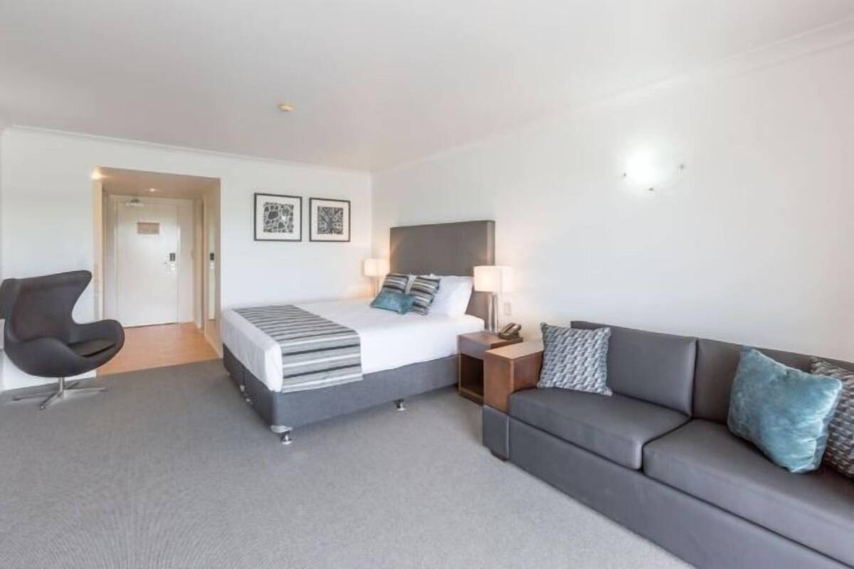 Desk, blackout curtains, iron/ironing board, bed sheets