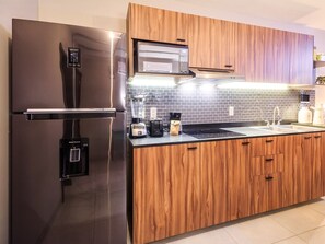 Fridge, microwave, stovetop, coffee/tea maker