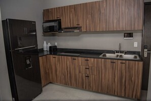 Fridge, microwave, stovetop, coffee/tea maker