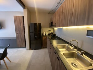 Fridge, microwave, stovetop, coffee/tea maker