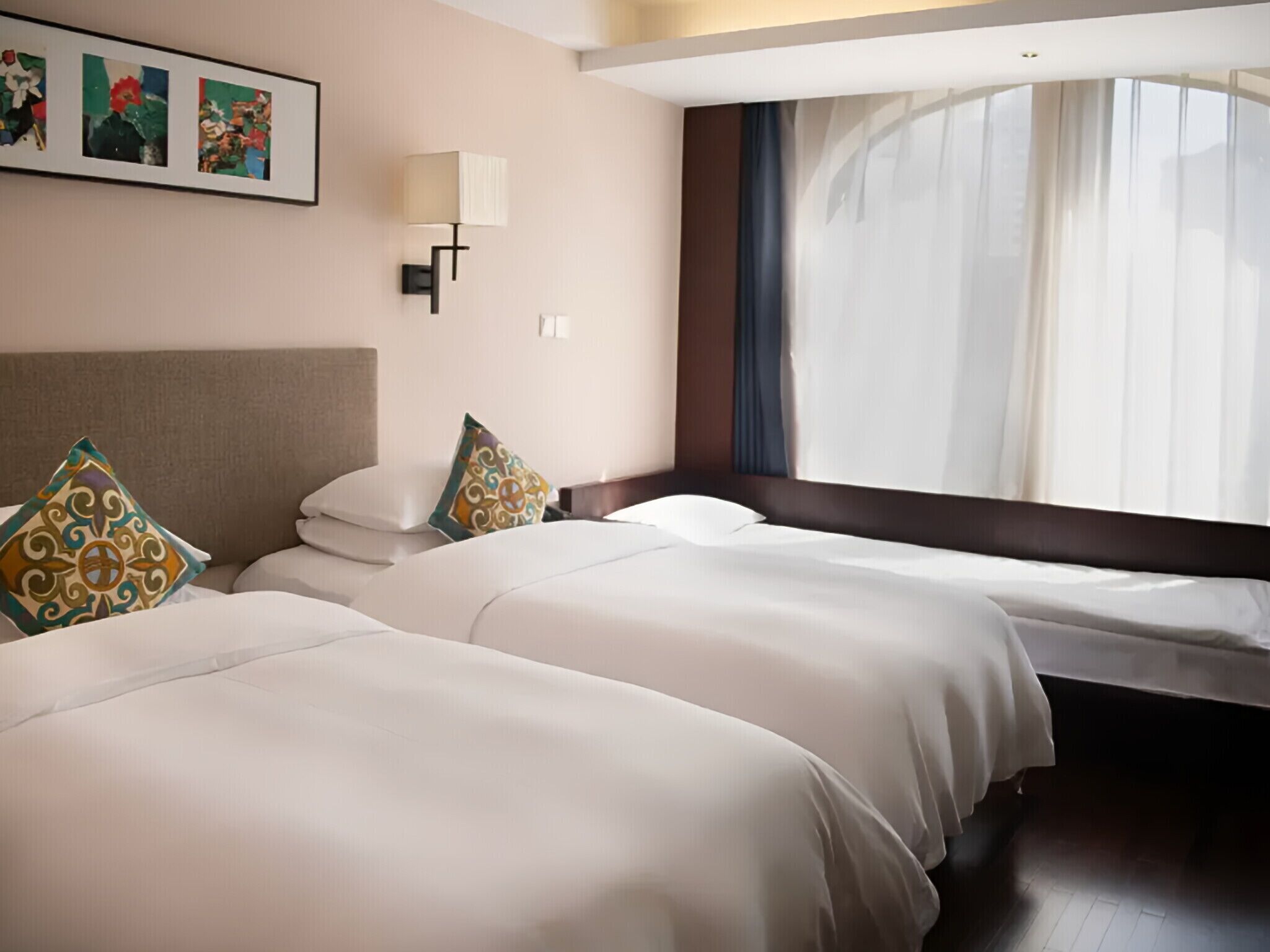 Family Triple Room | Minibar (free items), blackout drapes, soundproofing, bed sheets