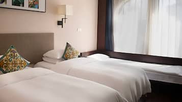 Family Triple Room | Minibar (free items), blackout drapes, soundproofing, bed sheets