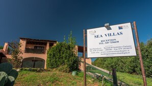 A sign for Sea Villas Reception with contact information. - Charming Sea Villas Es Sleeps 6 With Private Pool Extra bed Possible (Stintino)