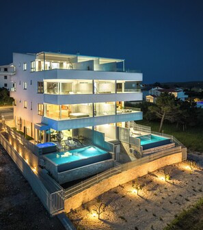 Enjoy expansive outdoor spaces and a rooftop pool with scenic views from the multiple levels with balconies.