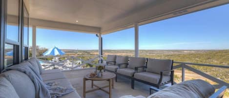 A spacious outdoor seating area with a view of the landscape.