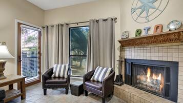 Condo, Multiple Beds, Pool Access | Living area | TV, fireplace