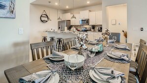 A modern kitchen with white cabinets, a central island, and pendant lighting. - Windsor Island 7br, Free Pool Heat, 5min Walk To L (Davenport)