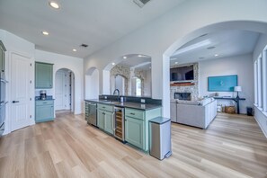 Enjoy cooking in the well-equipped kitchen with a central island and ample counter space.