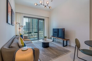 Apartment (1 Bedroom) | Living room | 50-cm plasma TV with satellite channels - Luxury Burj Royale in the heart of Downtown (Dubai)