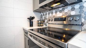 Luxury Condo | Private kitchen | Full-sized fridge, microwave, oven, stovetop