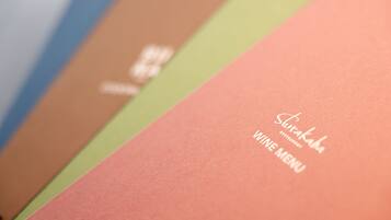 A menu with the text "Shirakaba" and "VINE MENU" on a pink background.