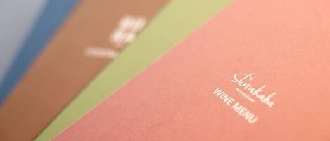 A menu with the text "Shirakaba" and "VINE MENU" on a pink background.