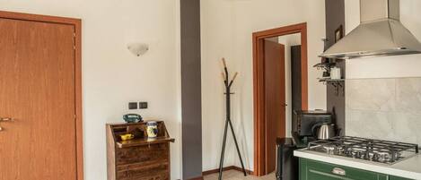 Fridge, oven, coffee/tea maker, cookware/dishes/utensils