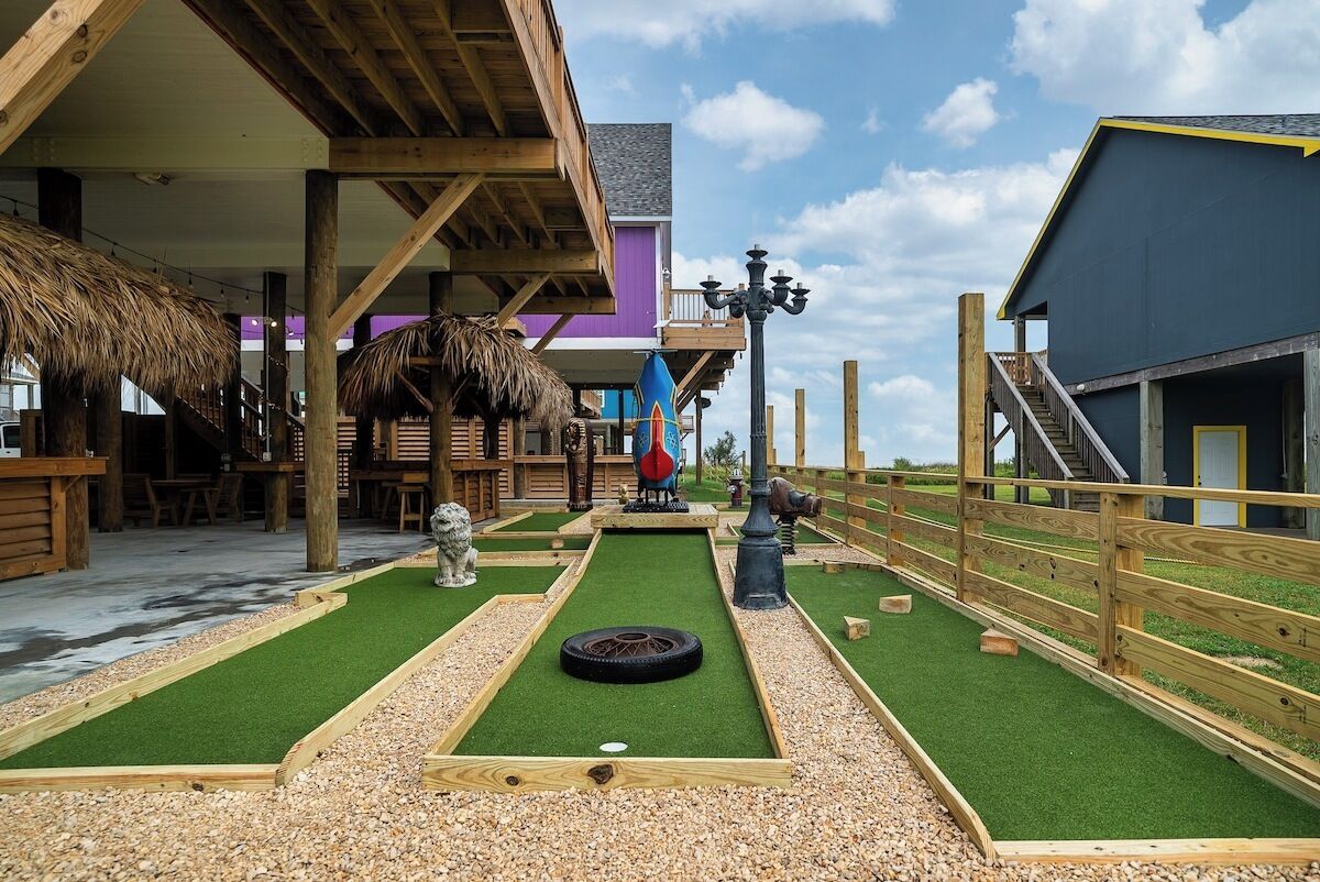 Beach House Dupe · Beach paradise with mini golf course by the water!